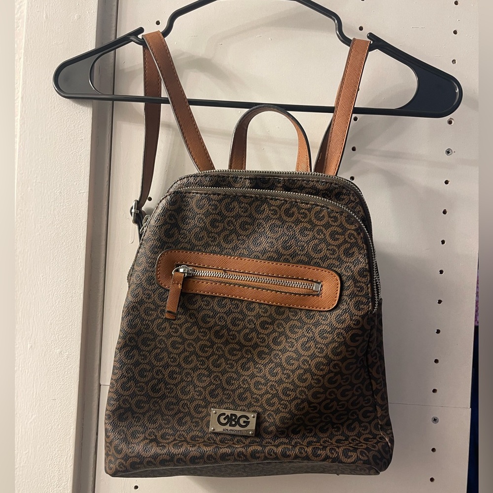 G by guess black and brown backpack purse.